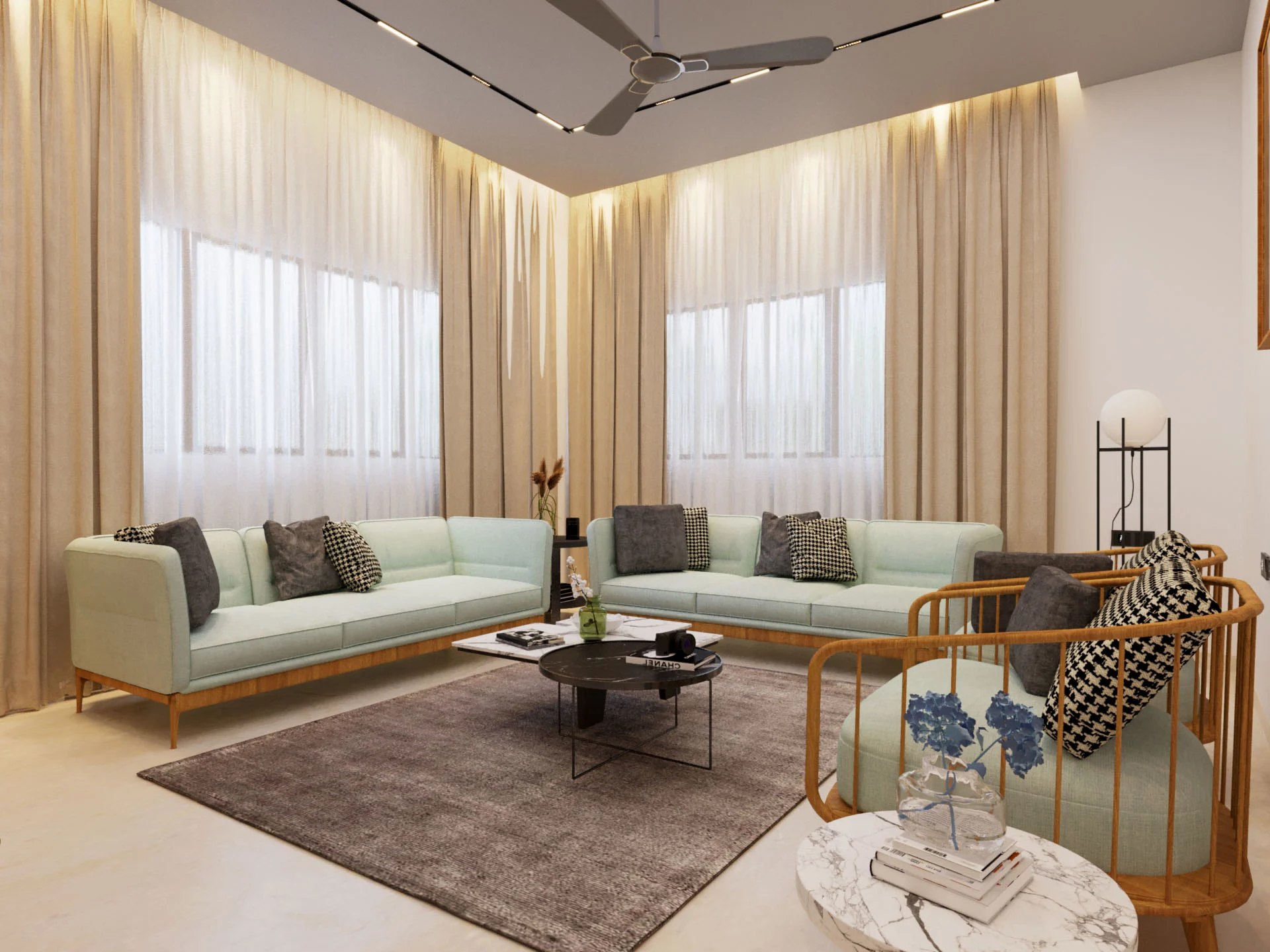Elegant living room corner with mint green sofas, layered curtains, modern ceiling fan, and cozy seating arrangement