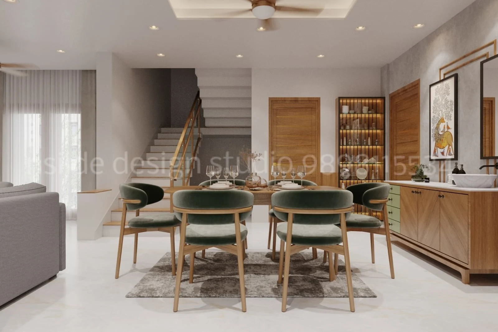 Contemporary dining area with round wooden table green velvet chairs staircase backdrop and glass crockery cabinet