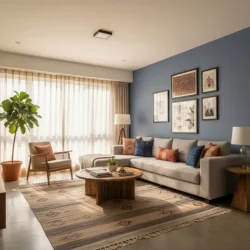 Modern open-plan office interior with long workstations, ergonomic chairs, acoustic ceiling panels, blue feature wall, and city view windows.